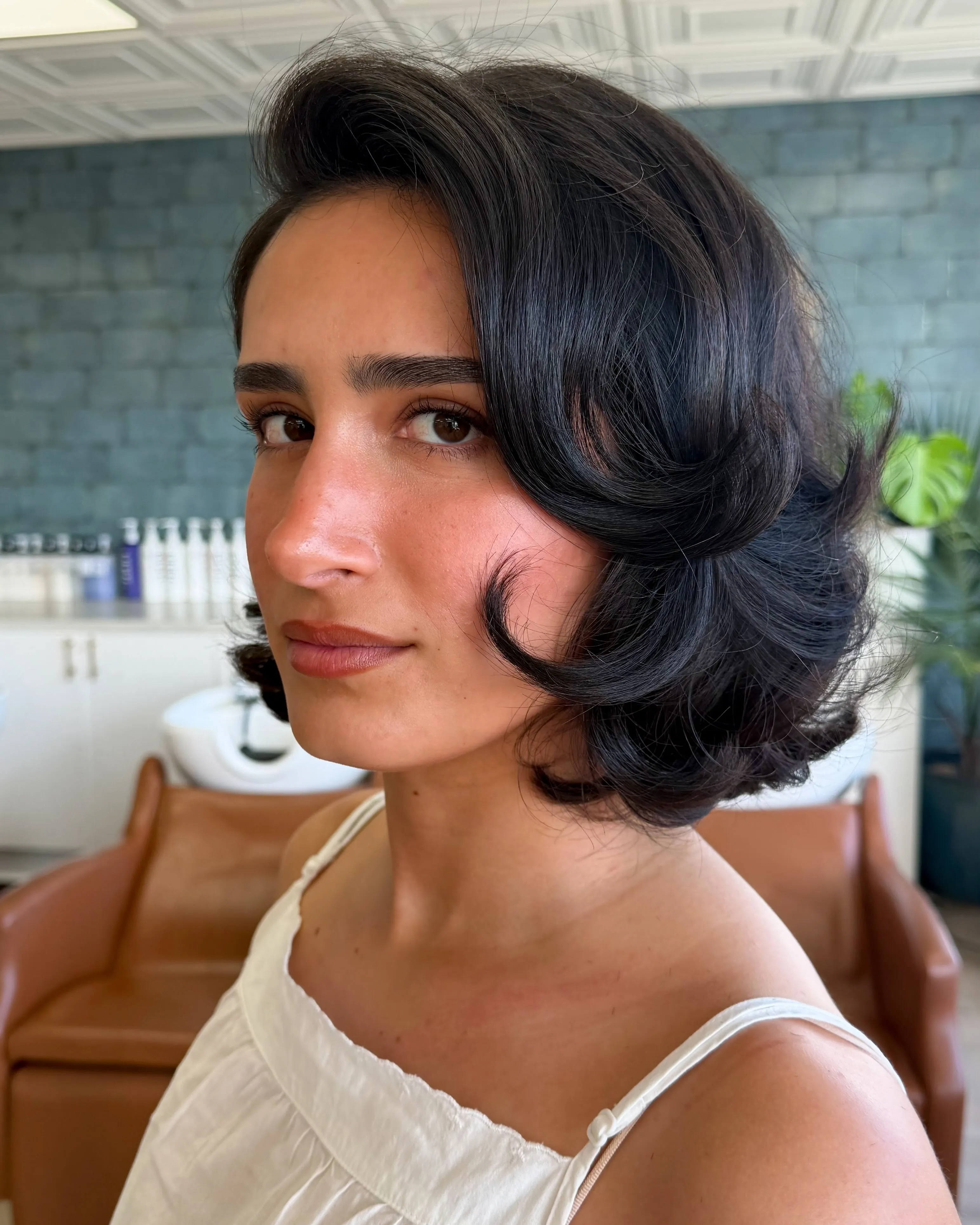 Sculpted short vintage bob with glossy side-swept waves