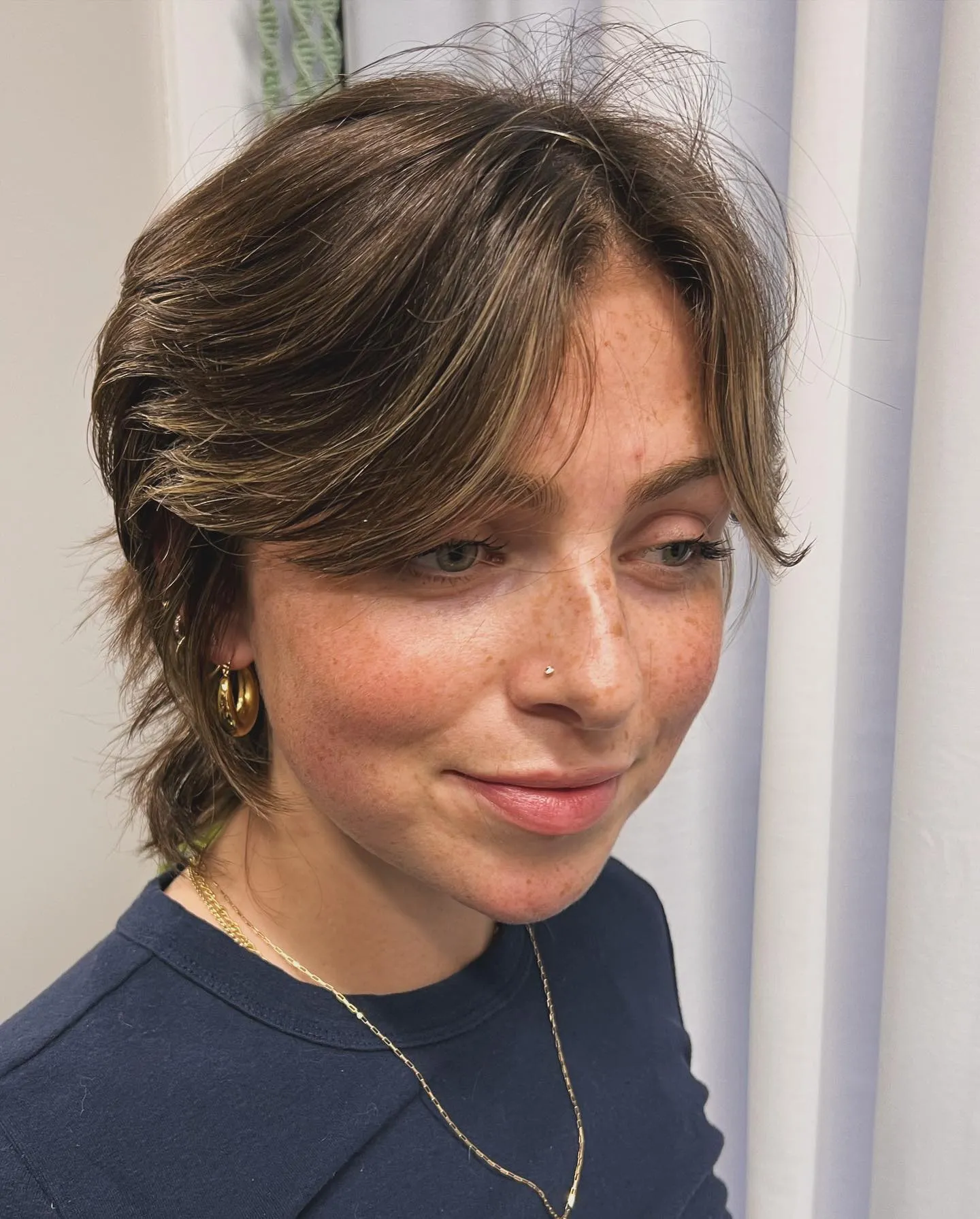 Shaggy short bixie with curtain fringe and flicked nape layers