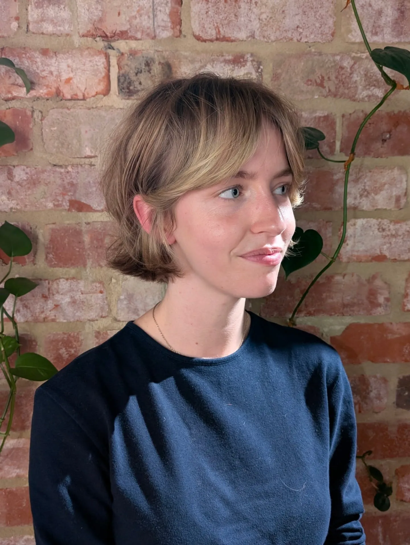 Soft short French bob with curtain bangs and tucked sides