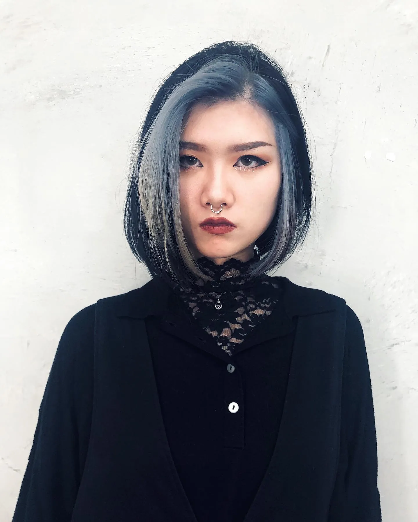 Sleek dark bob with pale face-framing panel