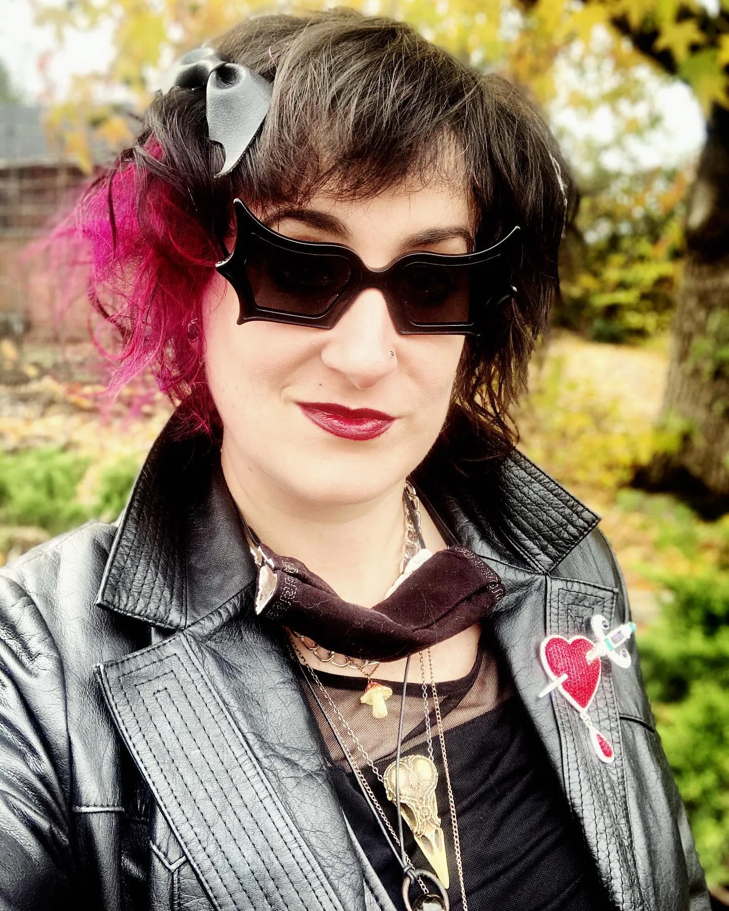 Choppy dark shag bob with vivid pink side panel