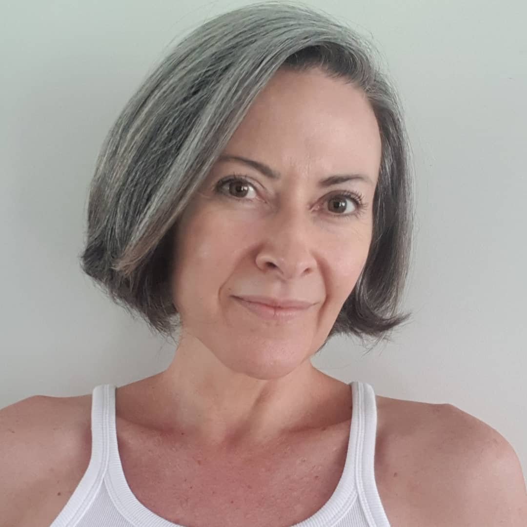 Chin-length gray bob with smooth curved ends