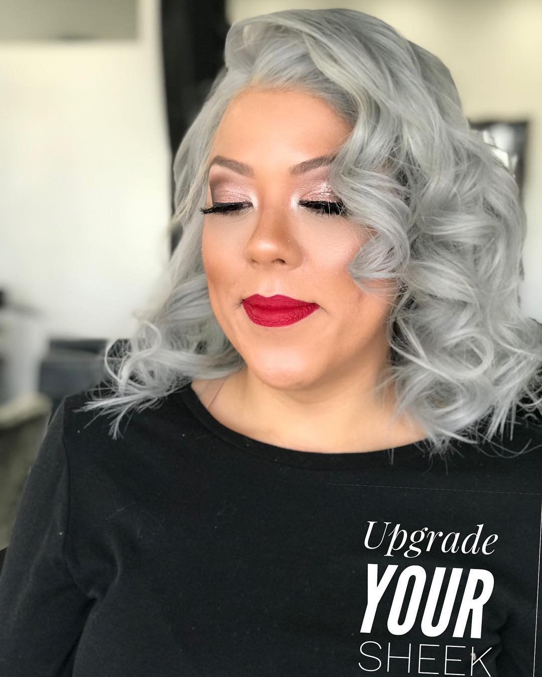 Side-parted gray bob with full defined curls