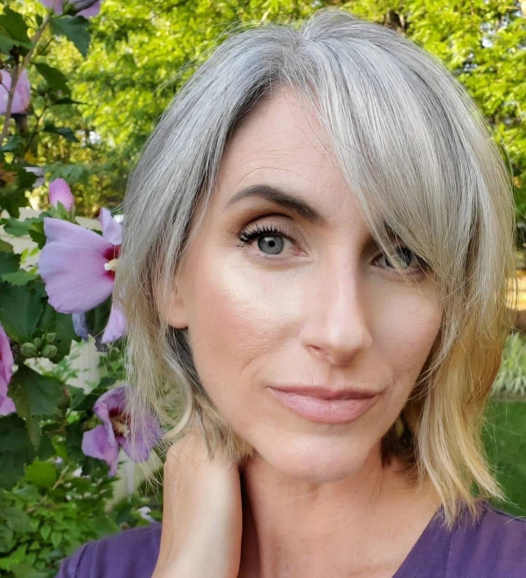 Layered gray bob with a long side-swept fringe