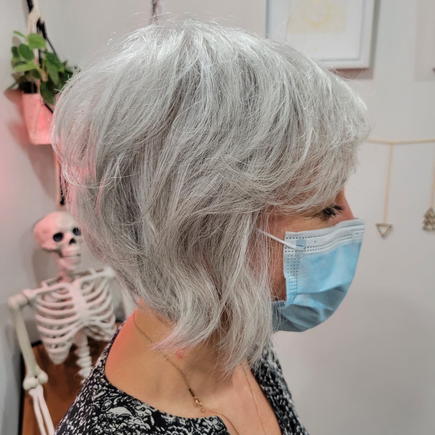 Shaggy gray bob with wispy layers and soft fringe