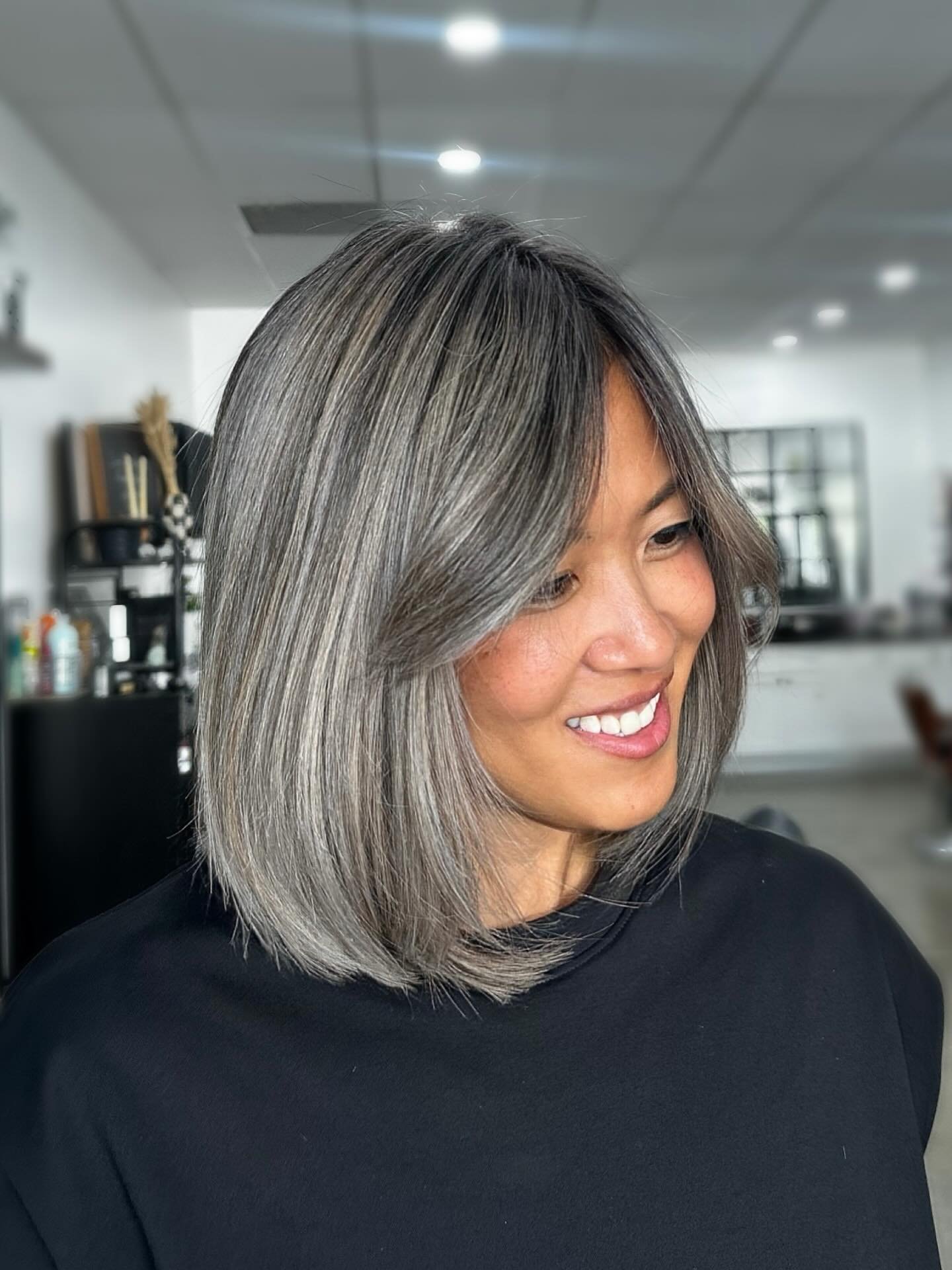 Sleek gray long bob with a centre part