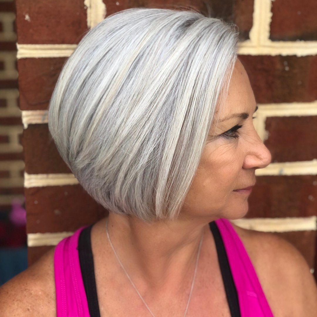 Angled gray bob with a deep side part and longer front