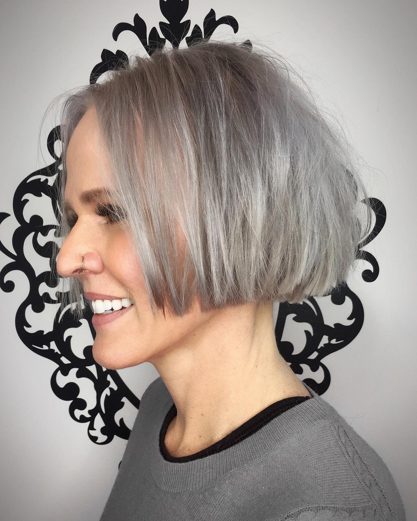 Blunt jaw-length gray bob with a smooth finish