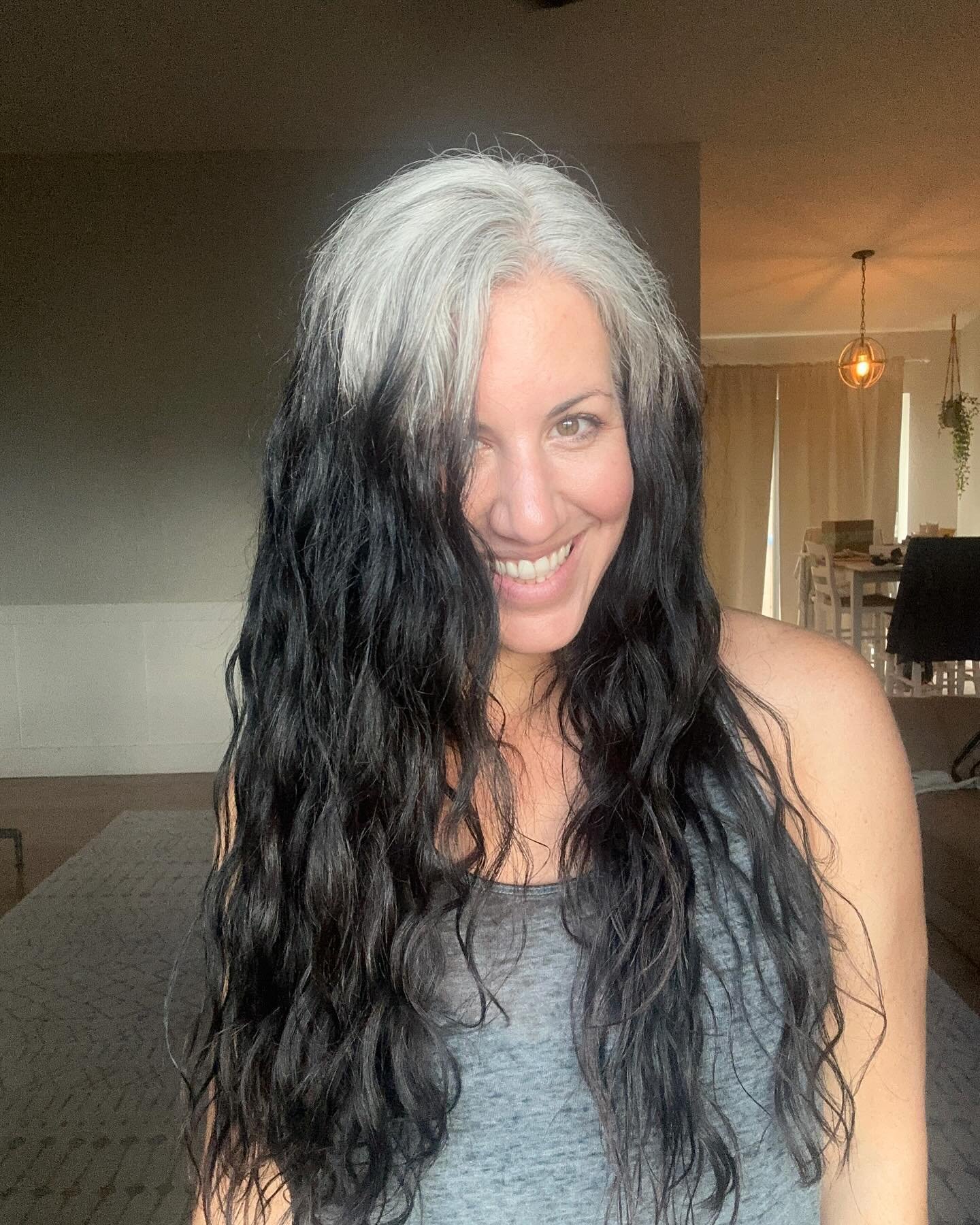 Long wet-look waves with a bold silver front section