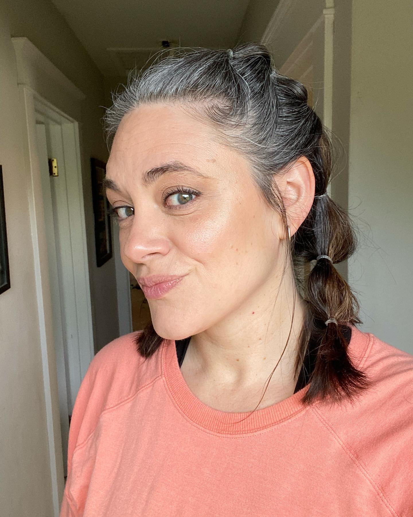 Sectioned bubble ponytail with silver roots and a small top knot