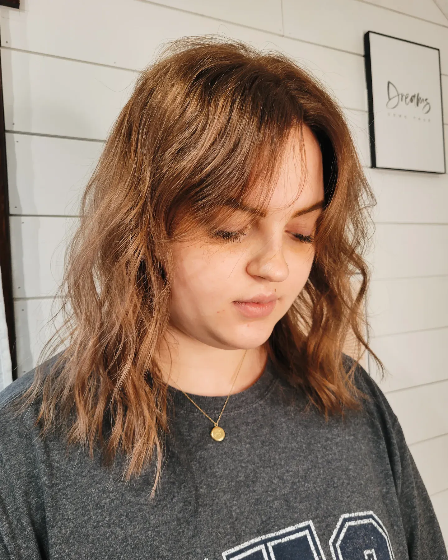 Tousled shoulder-length shag with curtain bangs and light layers