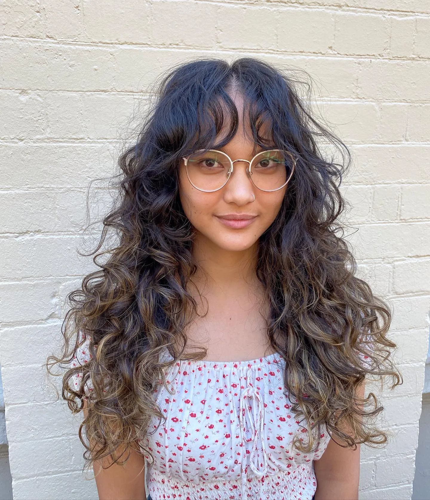 Long curly shag with curtain fringe and layered ringlets