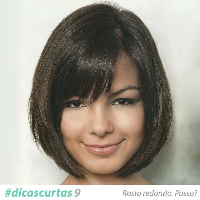 Rounded dark bob with a long side-swept fringe