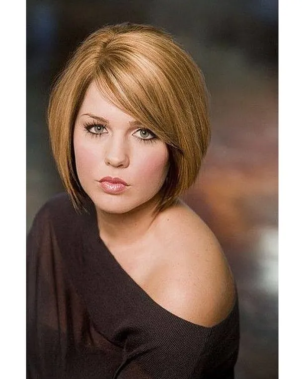 Sleek angled auburn bob with a long side-swept fringe