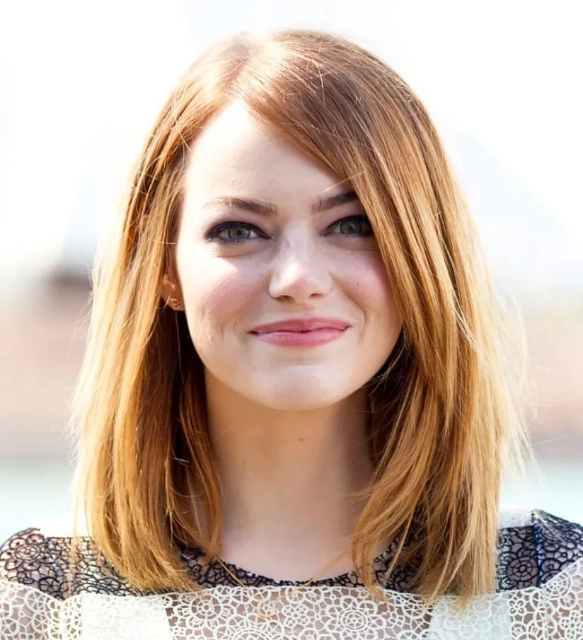 Straight copper collarbone bob with a soft side part