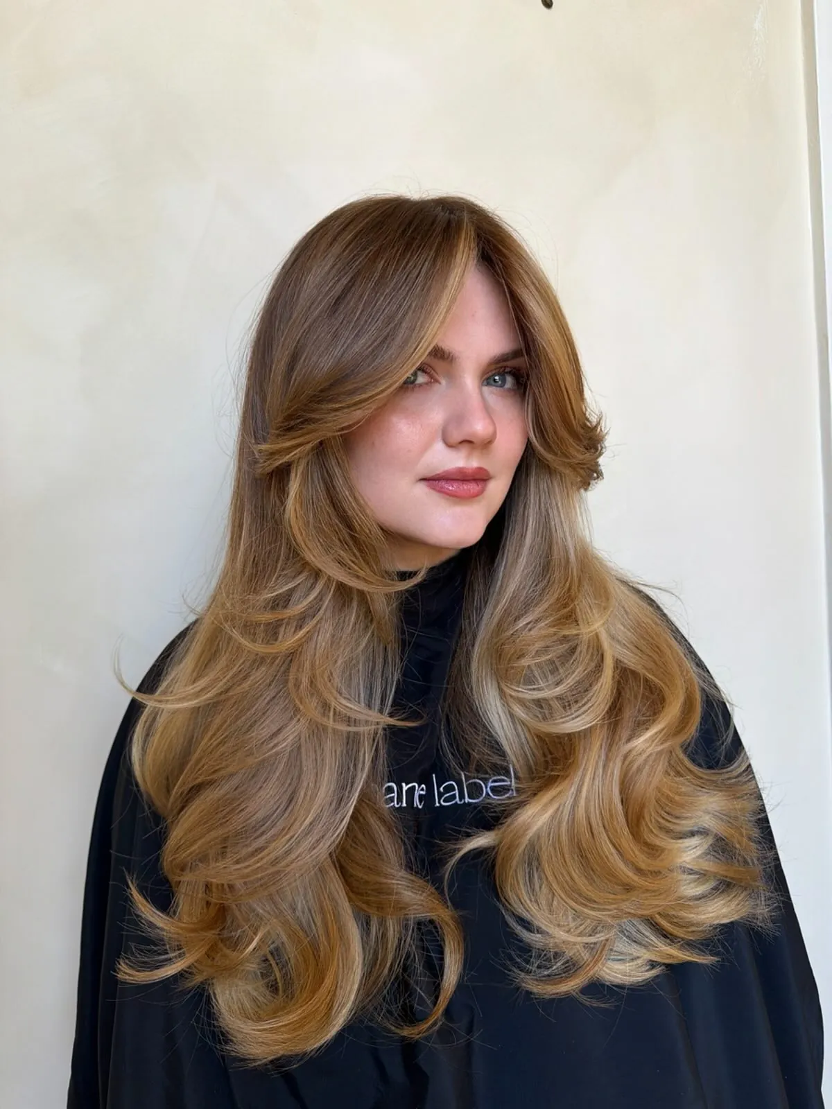 Long golden blonde layers with a full blowout