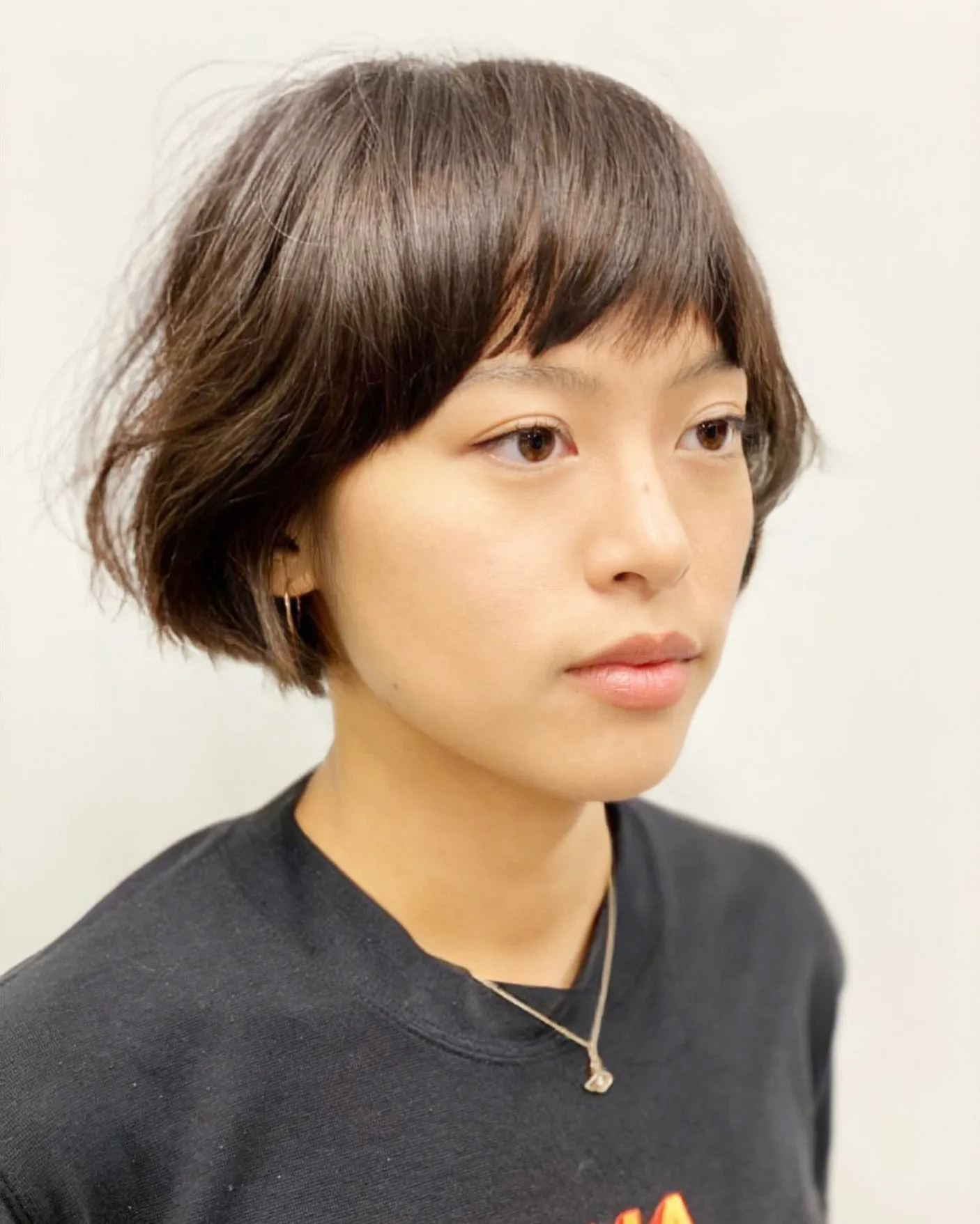 Soft layered jaw-length bob with side-swept fringe
