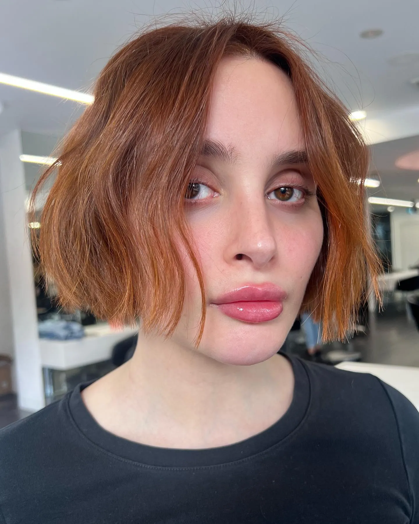 Blunt jaw-length bob with centre part