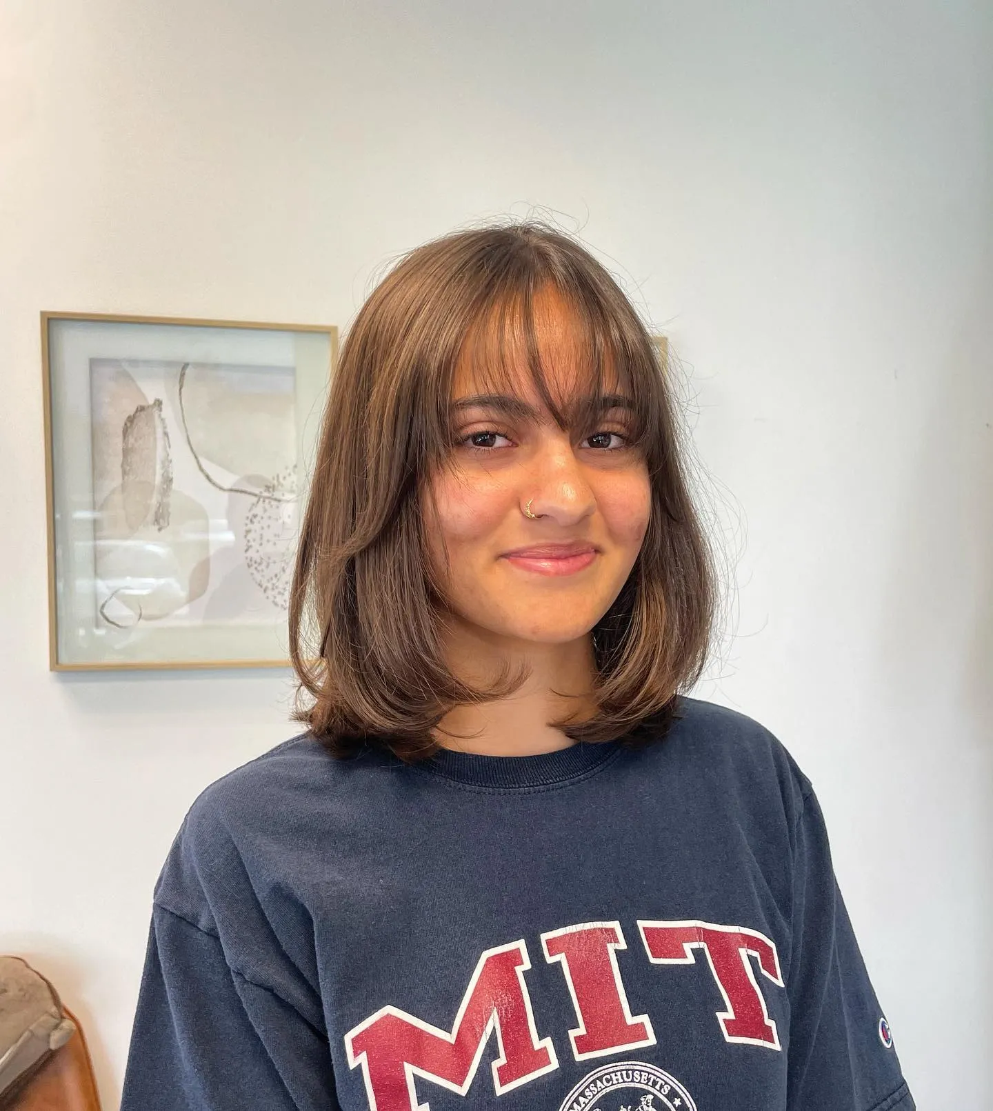 Layered lob with wispy full bangs and curved ends
