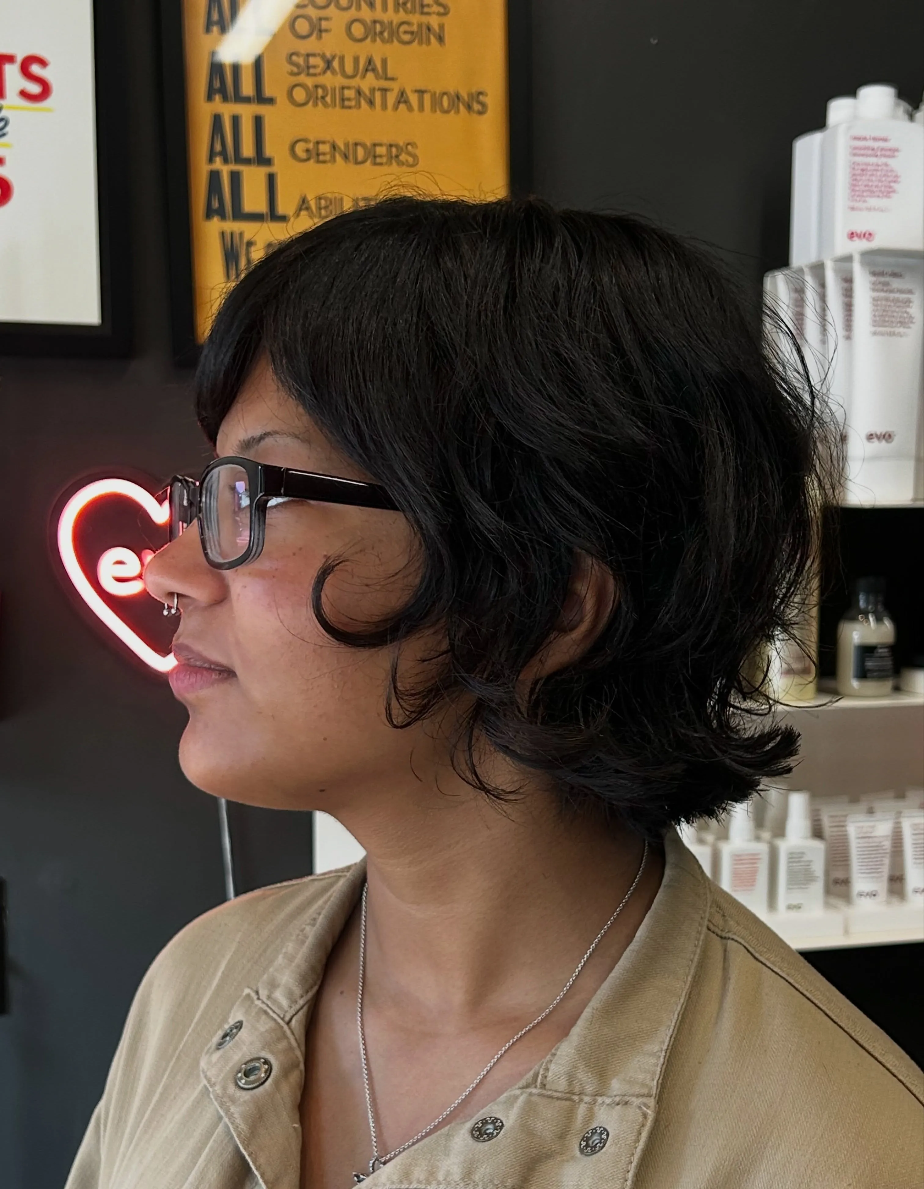 Short wavy layered bob with curved side bangs