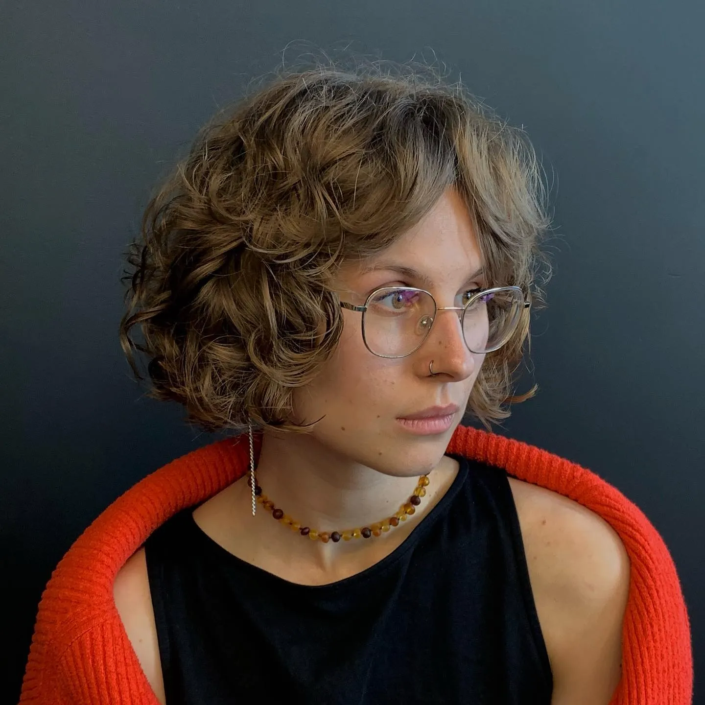 Curly layered bob with soft curly fringe