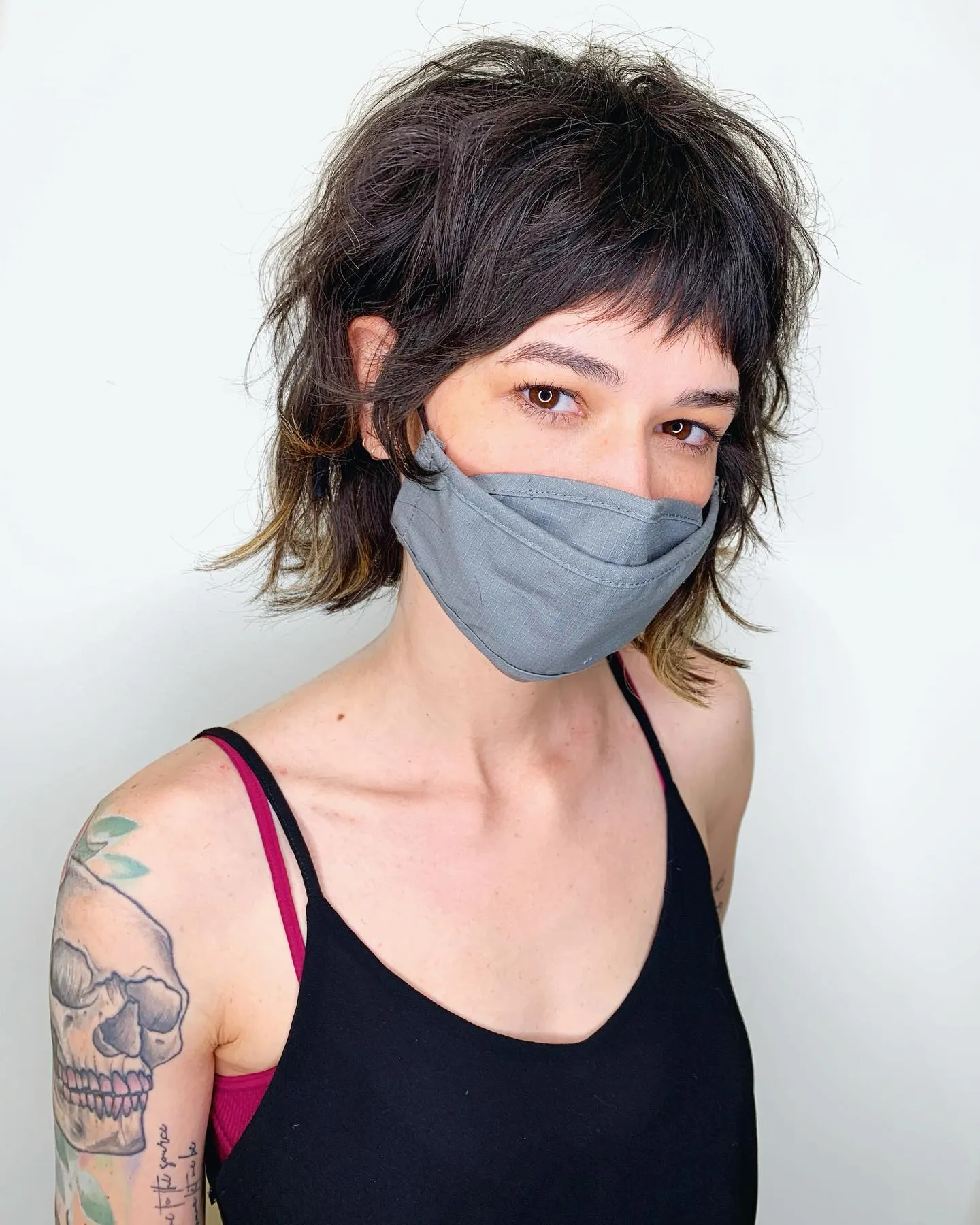 Shaggy layered bob with short micro bangs