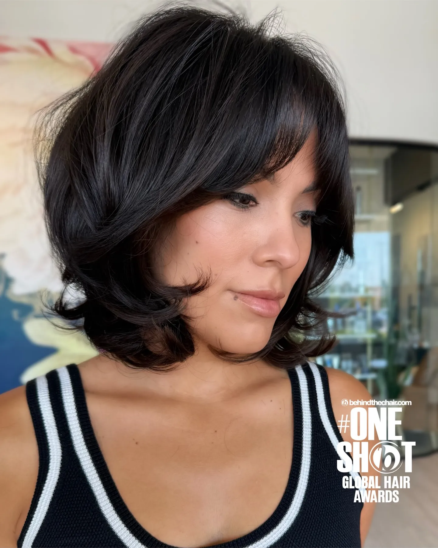Voluminous dark layered bob with sweeping curtain fringe
