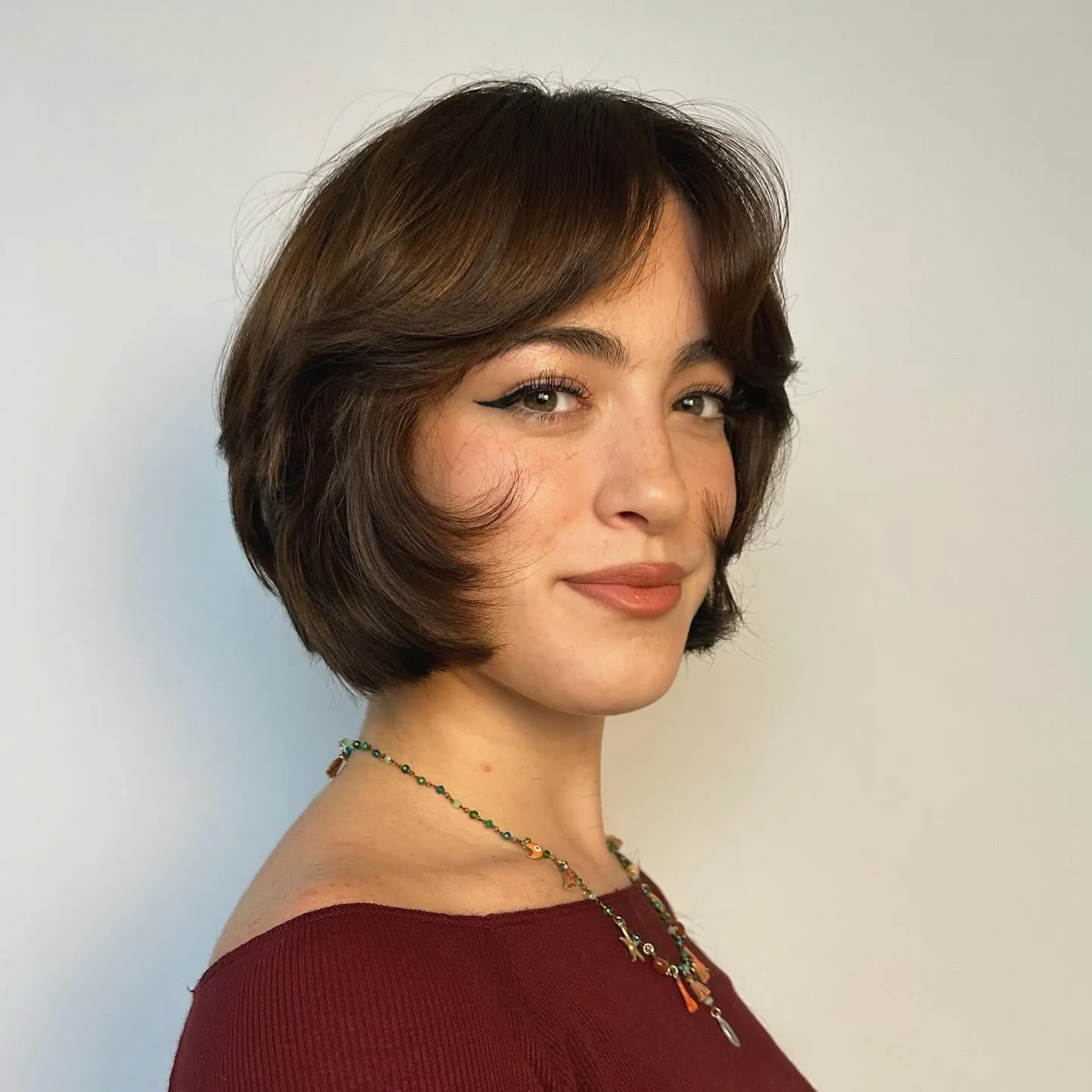 Rounded short layered bob with curtain fringe and curved front pieces