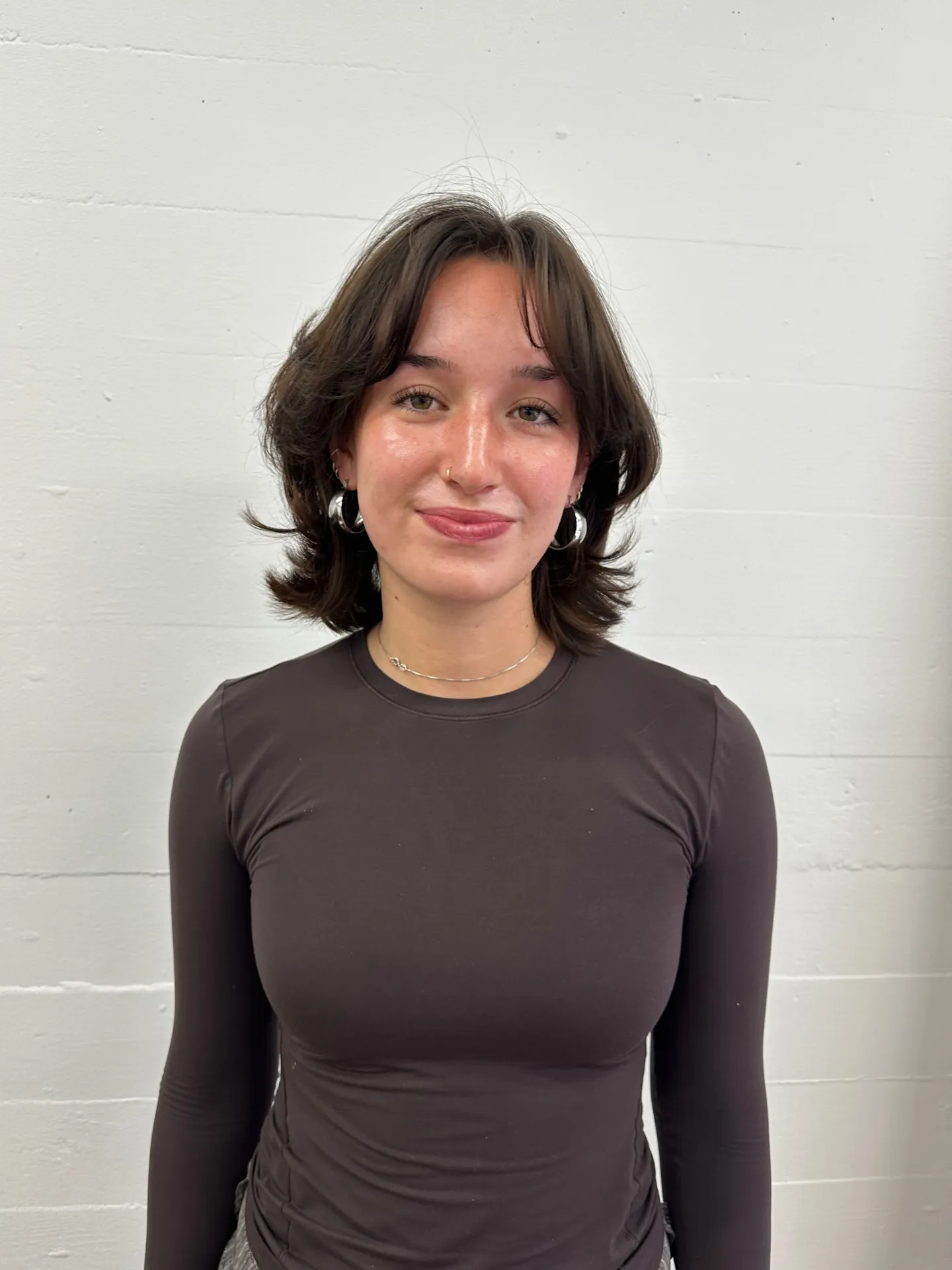 Flipped layered bob with curtain bangs and outward ends