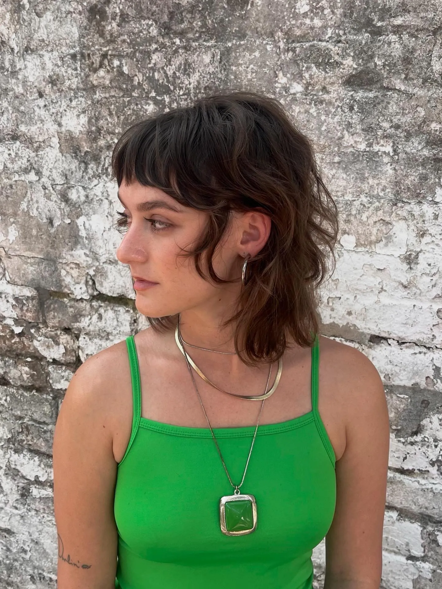 Shaggy layered bob with short fringe and longer textured back