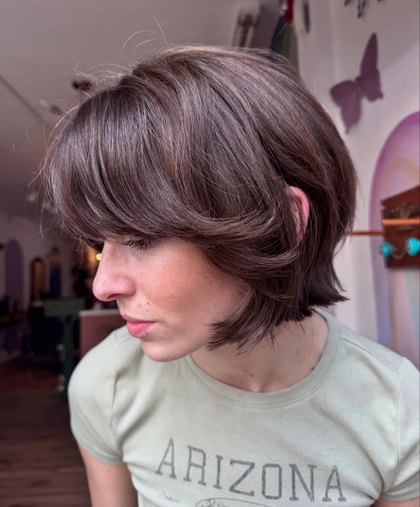 Side-swept layered bob with curved face-framing pieces