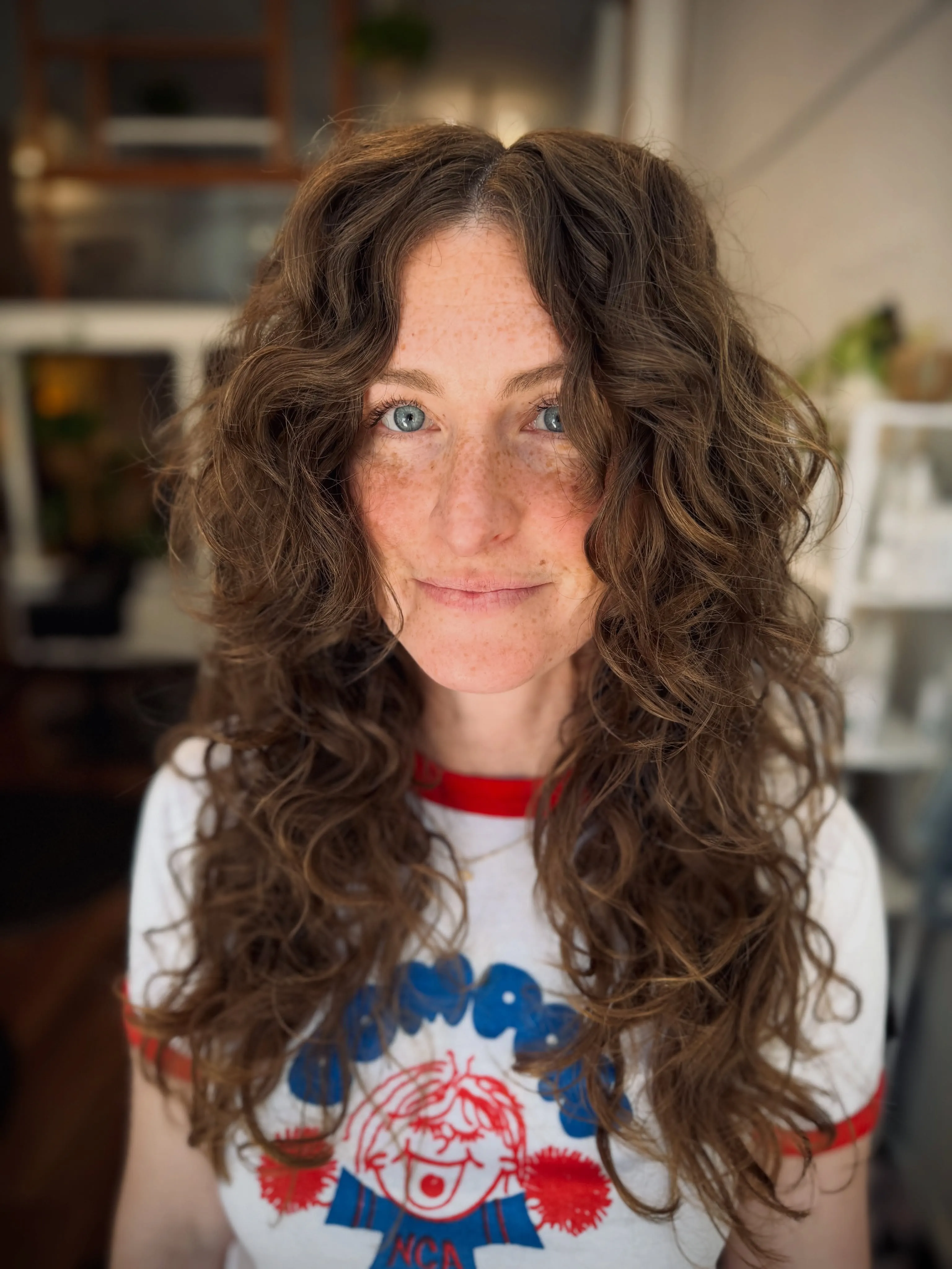 Long curly layers with center-parted volume
