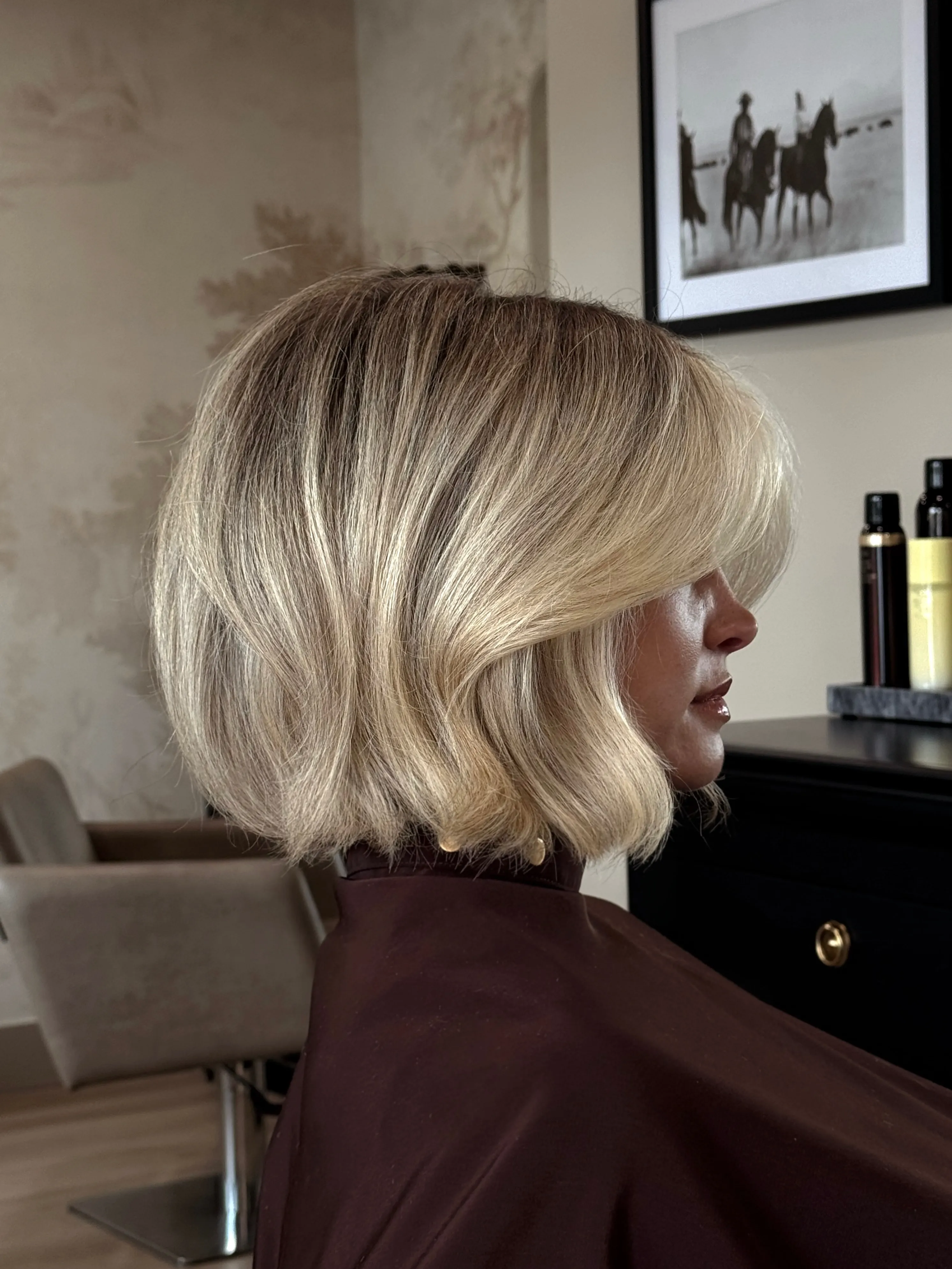 Wavy light blonde bob with deep side part