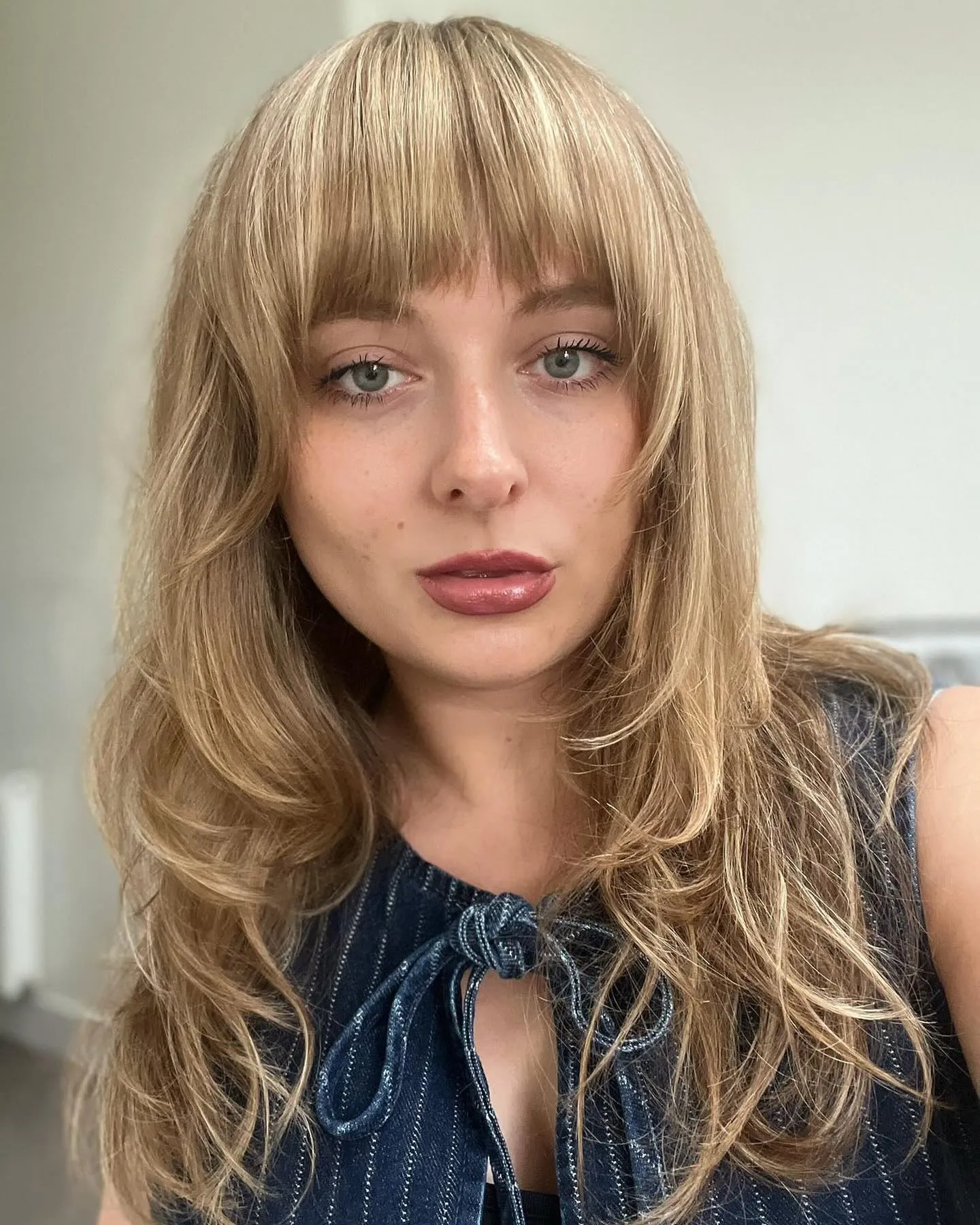 Long layered light blonde hair with wispy fringe