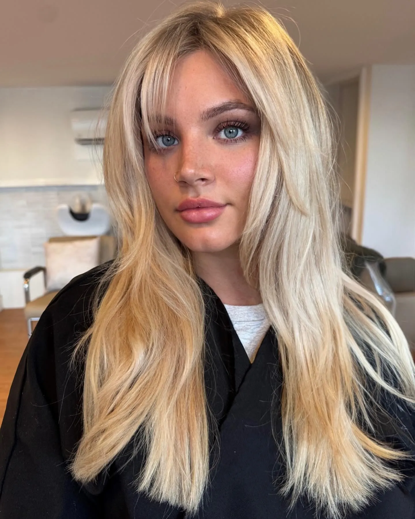 Long light blonde hair with curtain layers