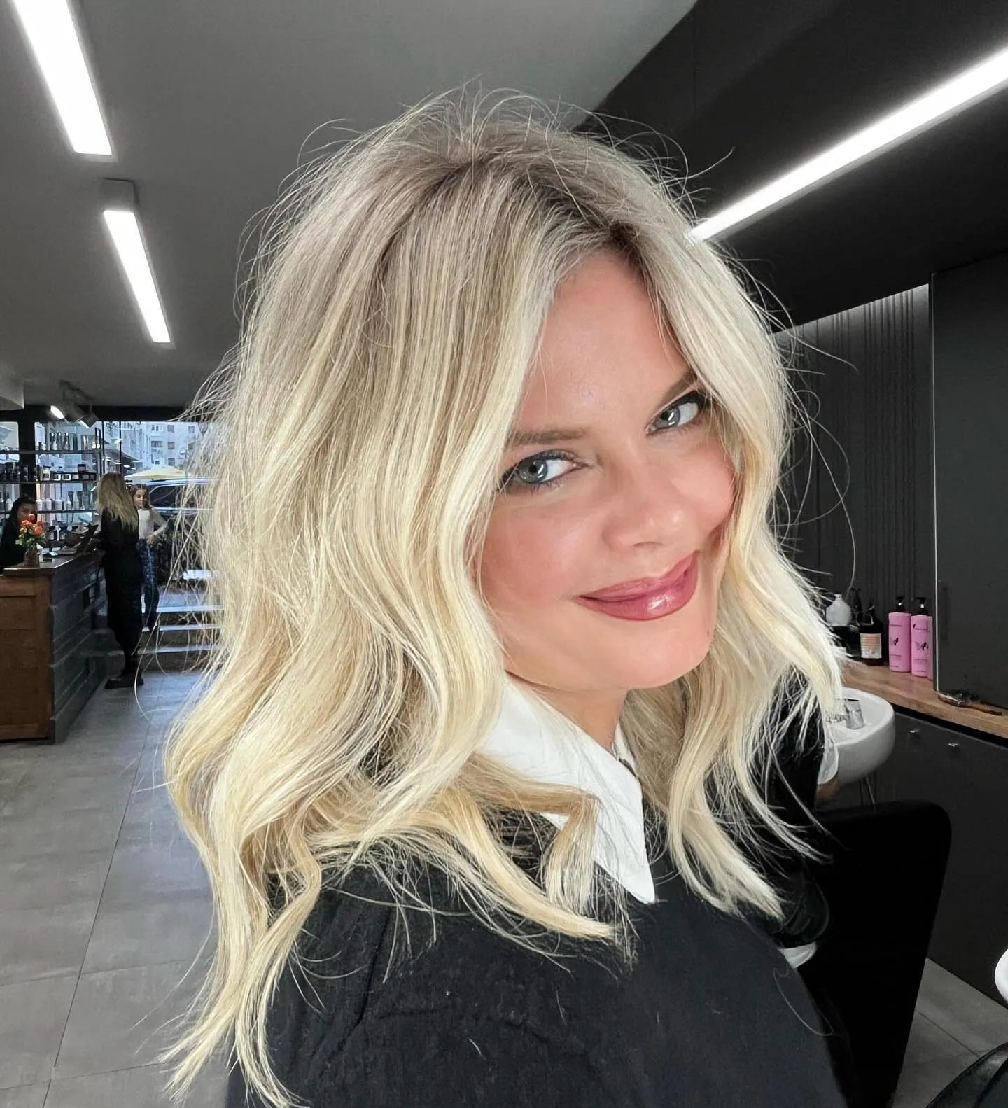 Bright light blonde lob with loose curls