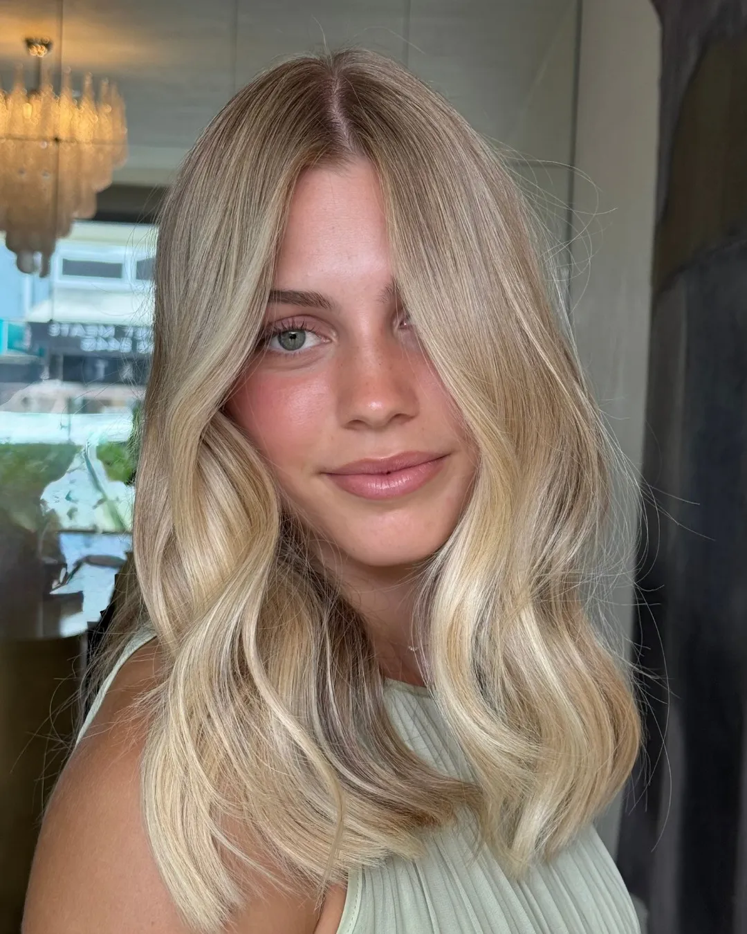 Soft light blonde waves with face-framing layers