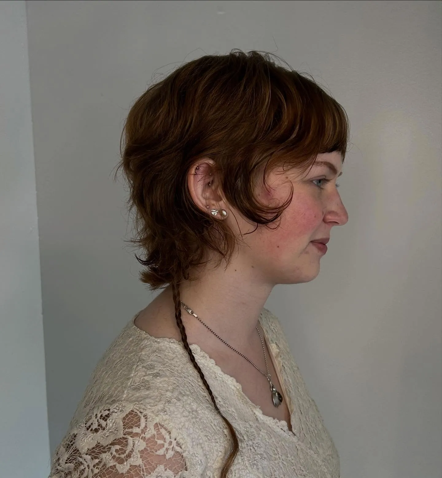Brown shaggy bixie with wispy fringe and flicked ends