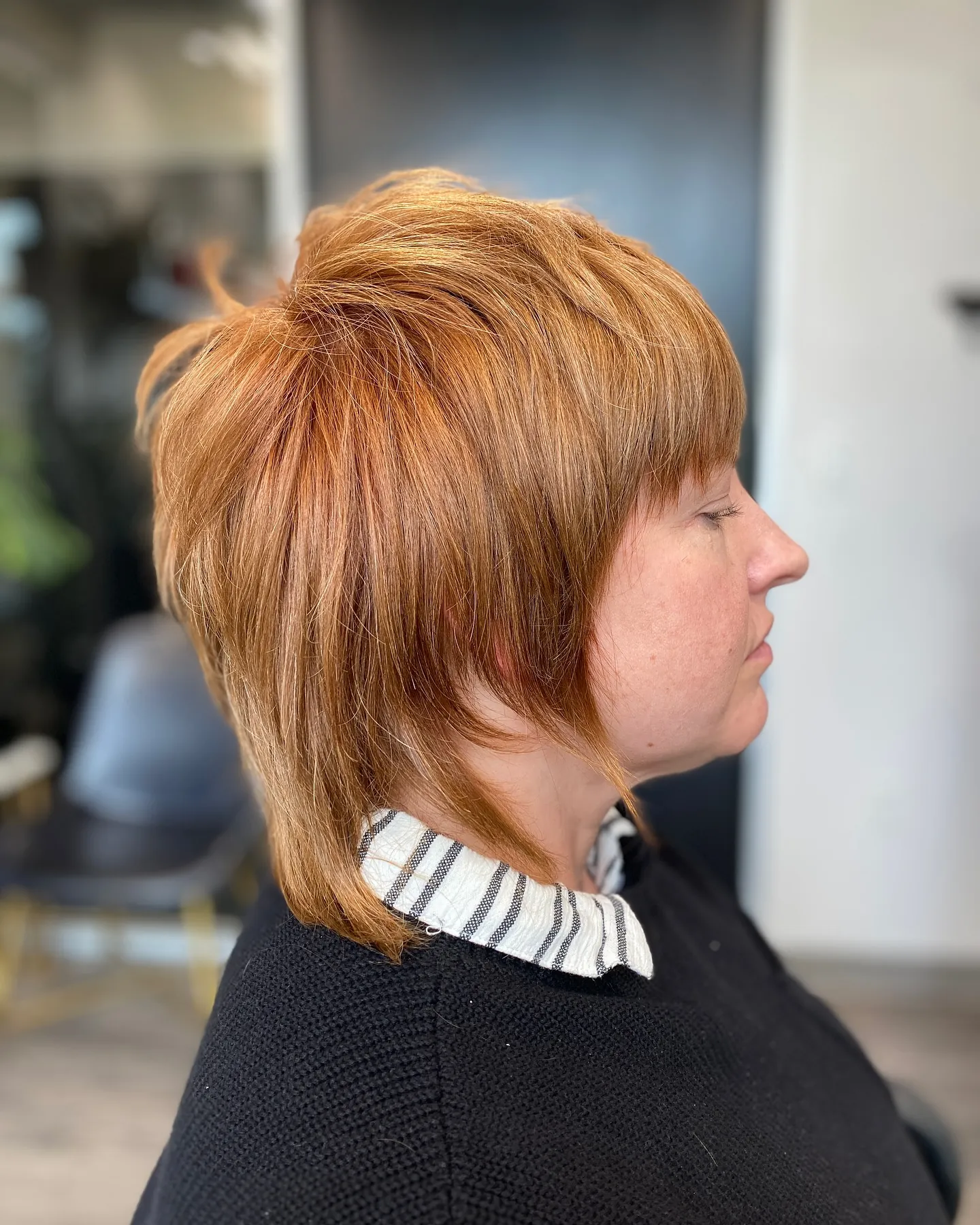 Copper feathered bixie with rounded crown and longer back