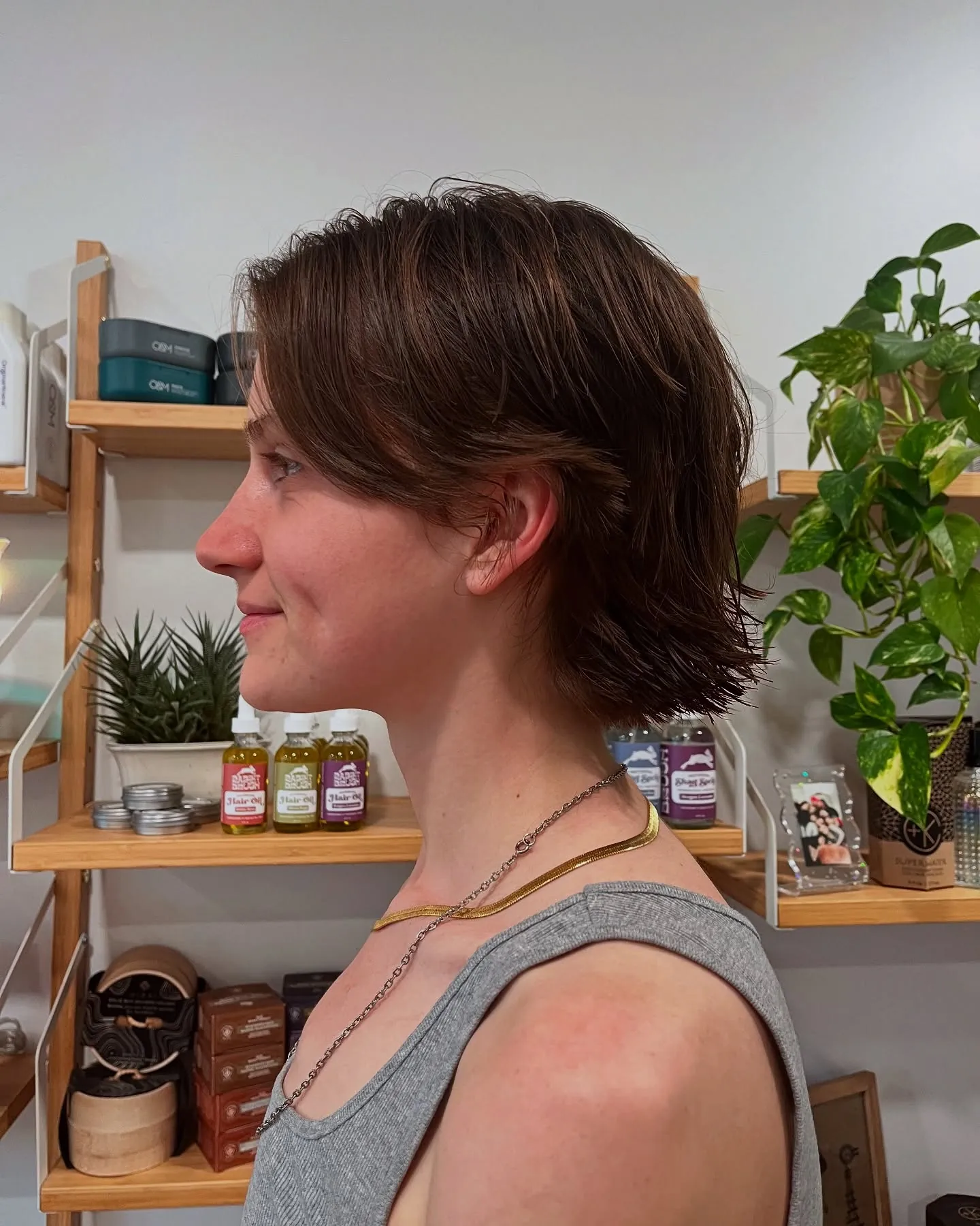 Brunette side-parted bixie with flipped nape