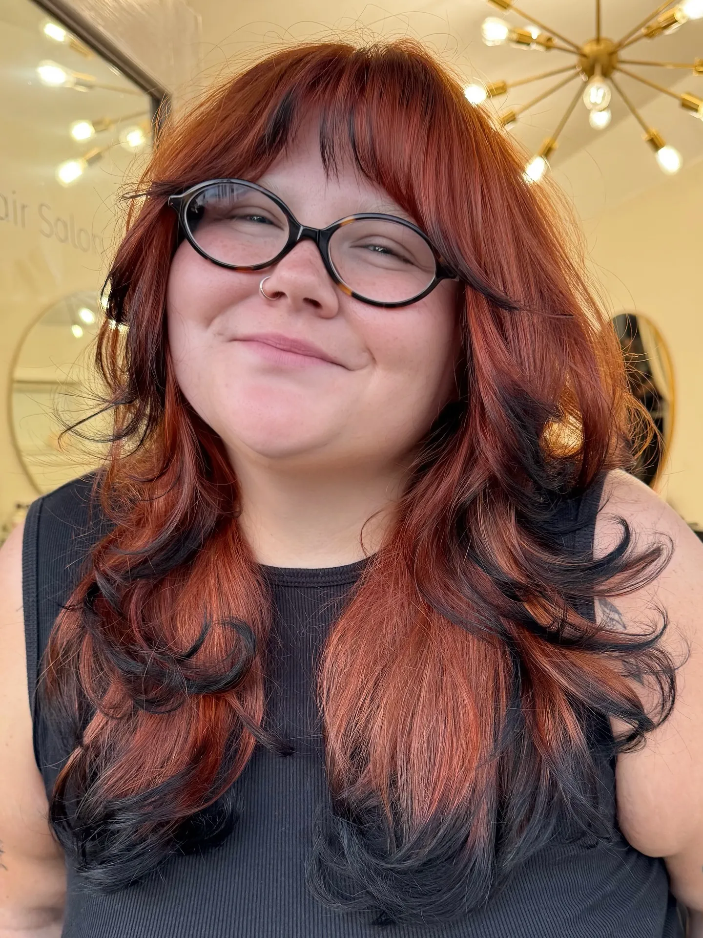 Long copper-red waves with black ends and bangs