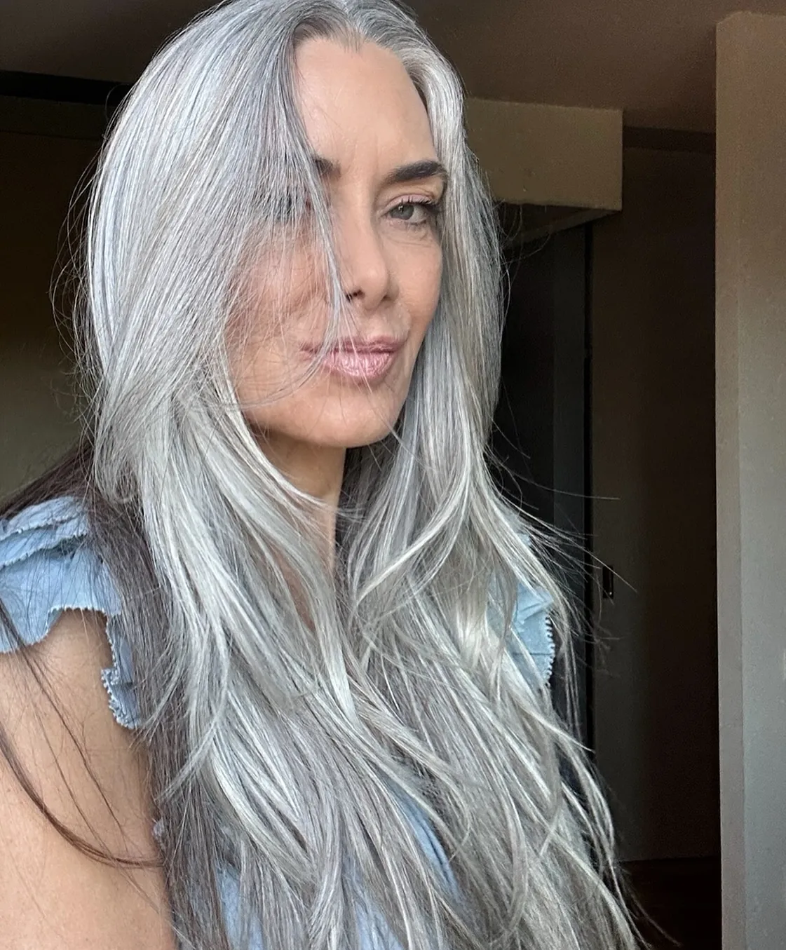 Sleek long silver layers with fine face framing