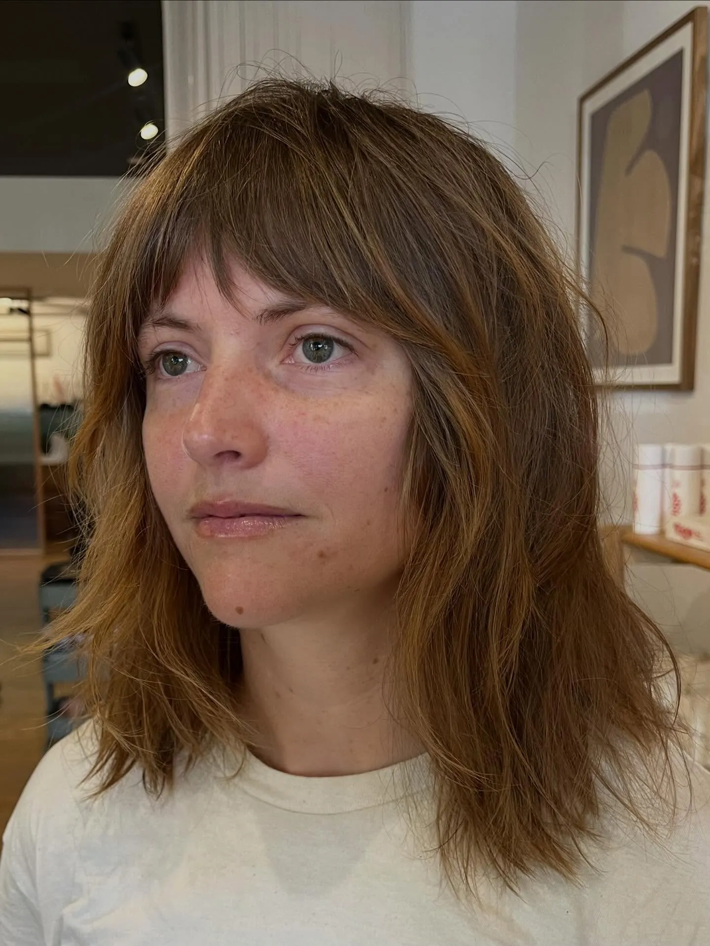 Textured shoulder-length shag with soft bangs
