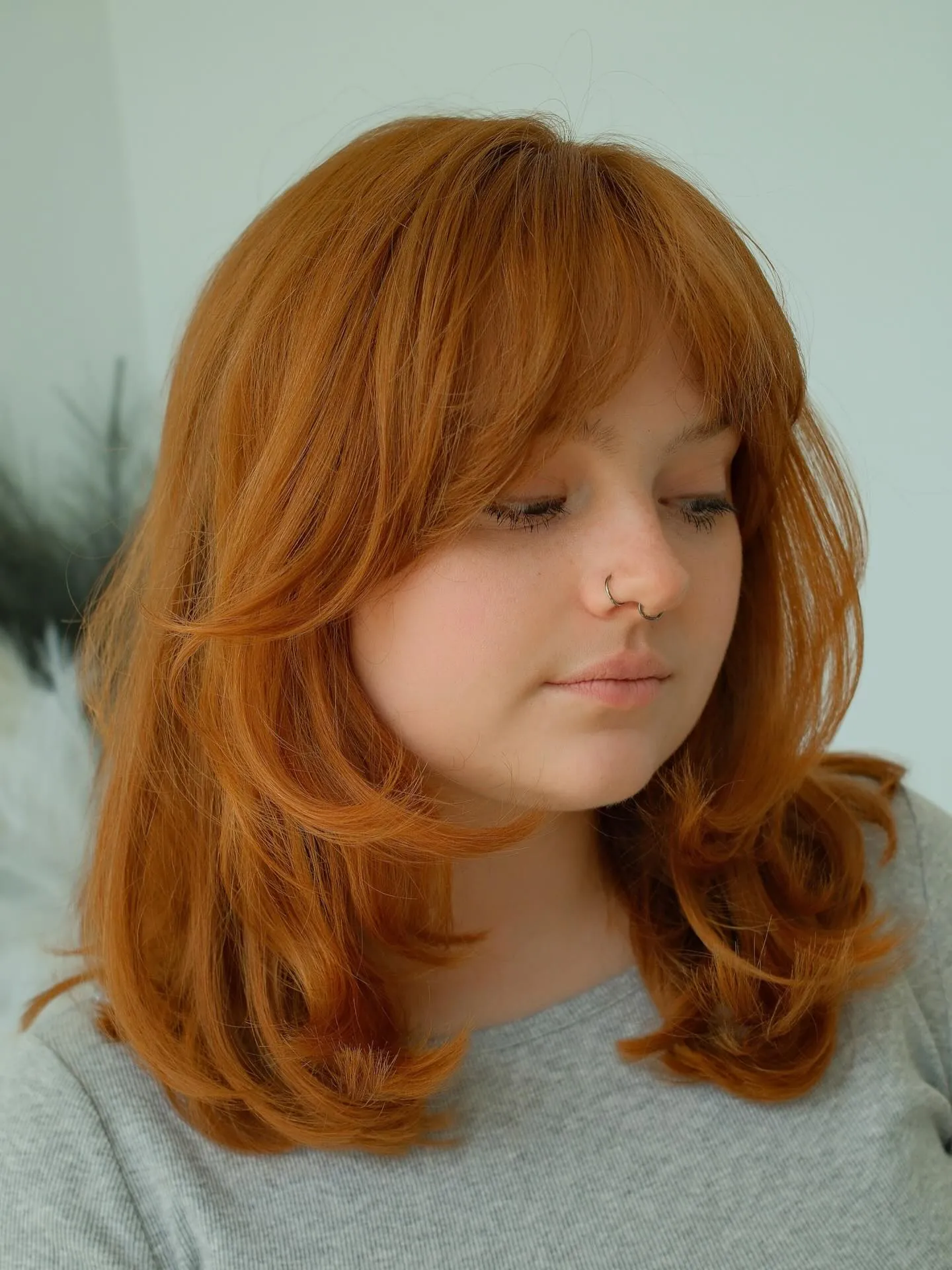 Copper layered shoulder-length cut with soft bangs