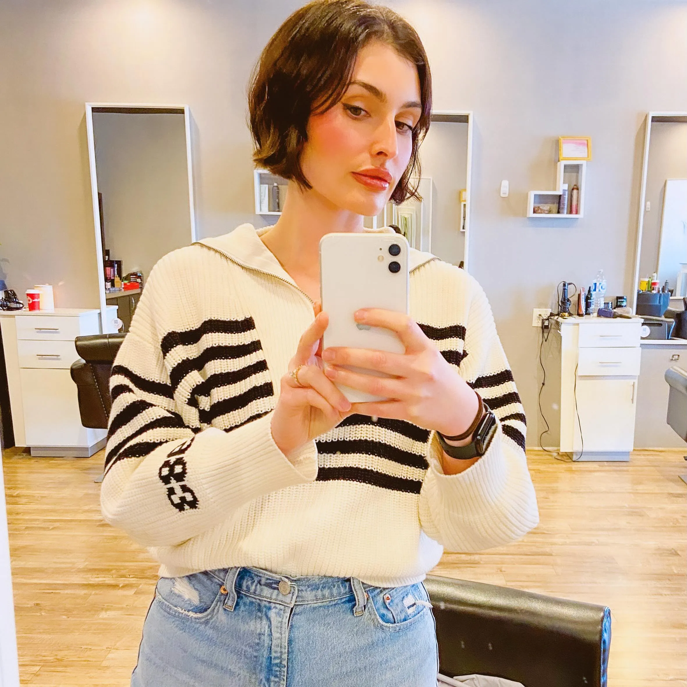 Short brunette micro bob with soft waves and tucked sides