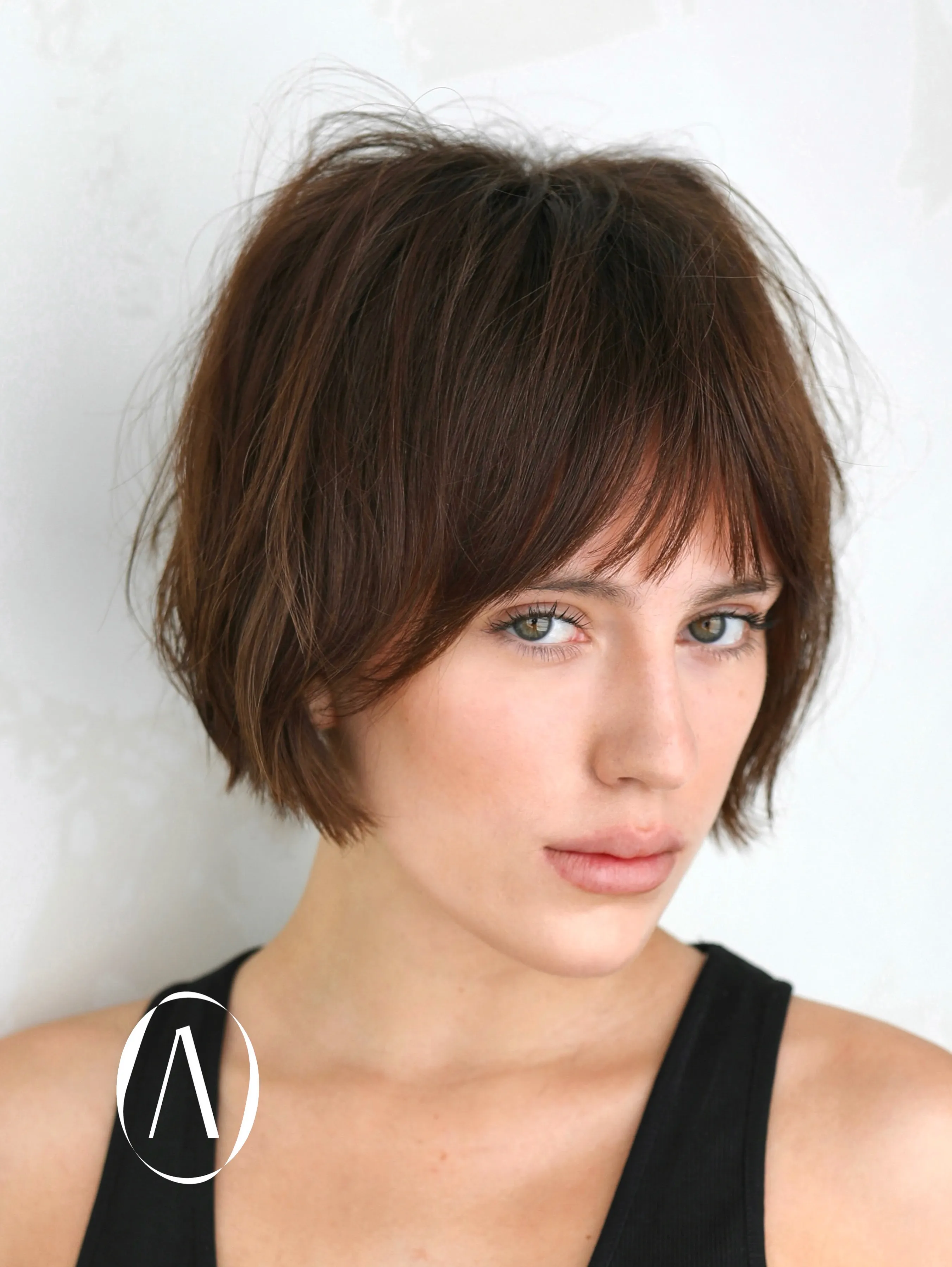 Soft brown micro bob with wispy fringe and lightly shaggy layers