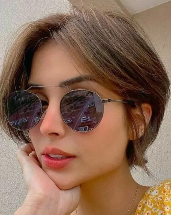 Short brunette bob with side-swept front and tucked back