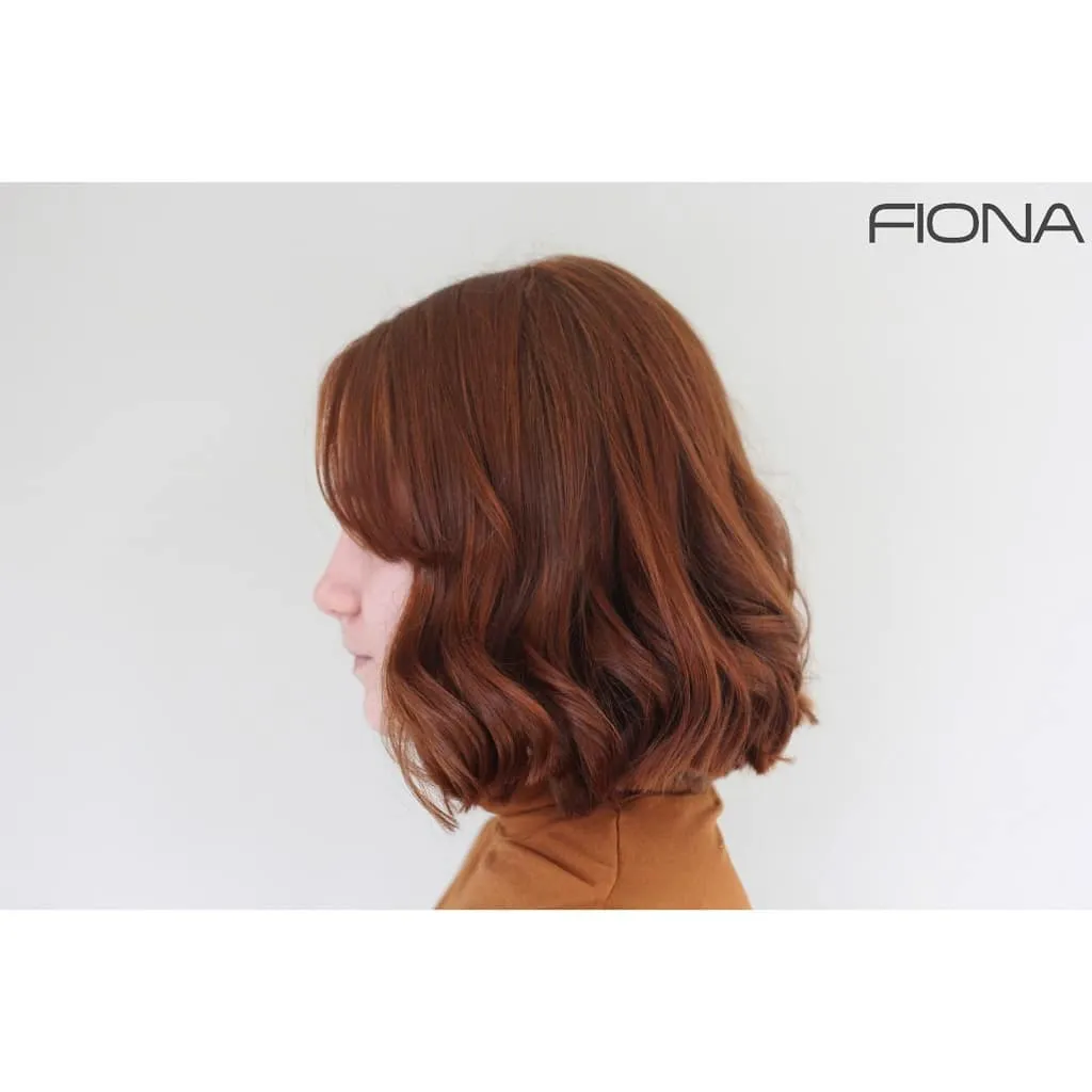 Wavy red bob with full fringe and rounded ends