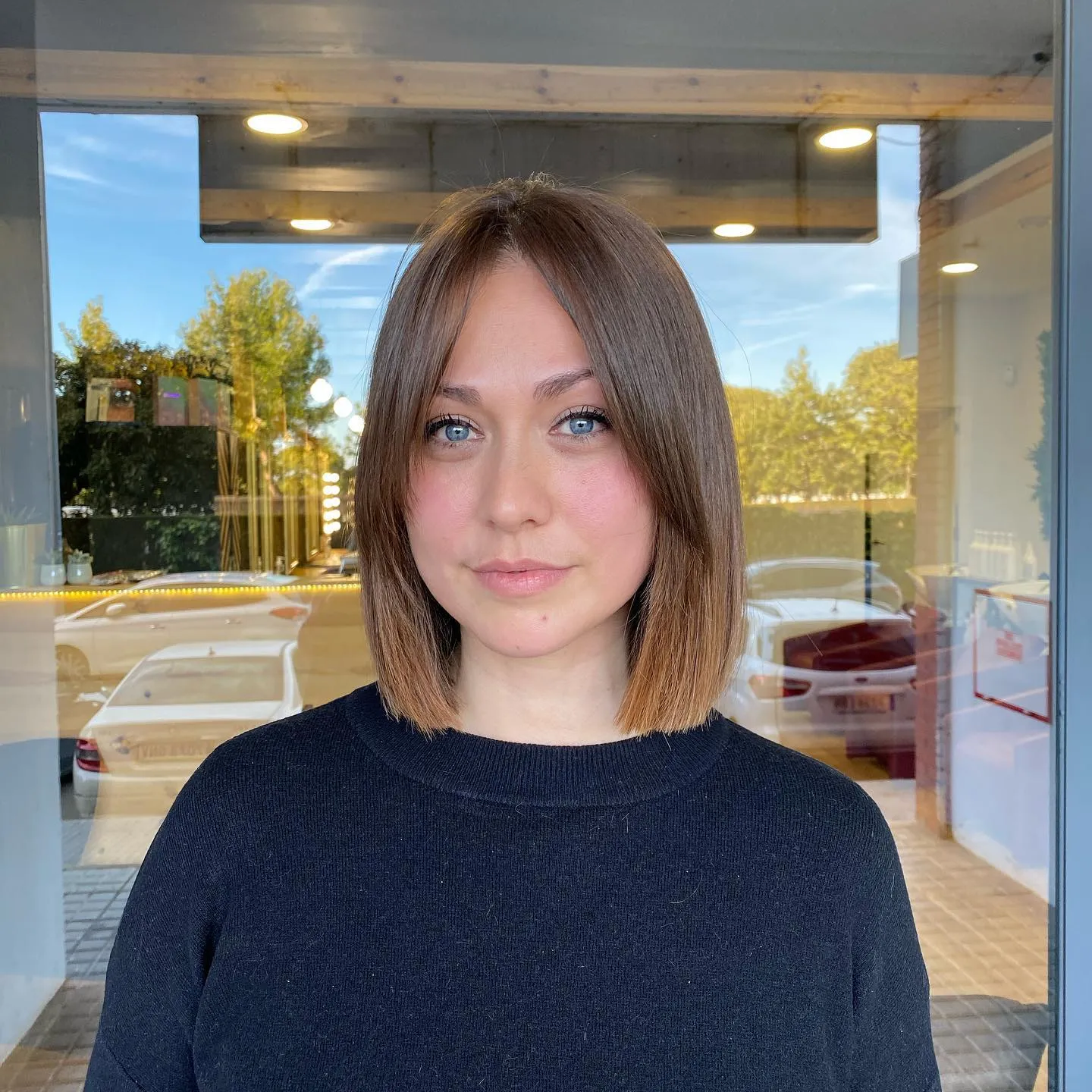 Straight blunt midi bob with a centre part