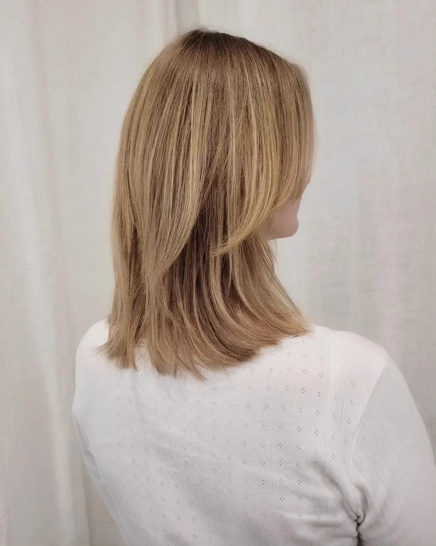 Soft layered midi bob with feathered back sections